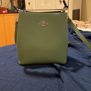 Green coach bucket bag